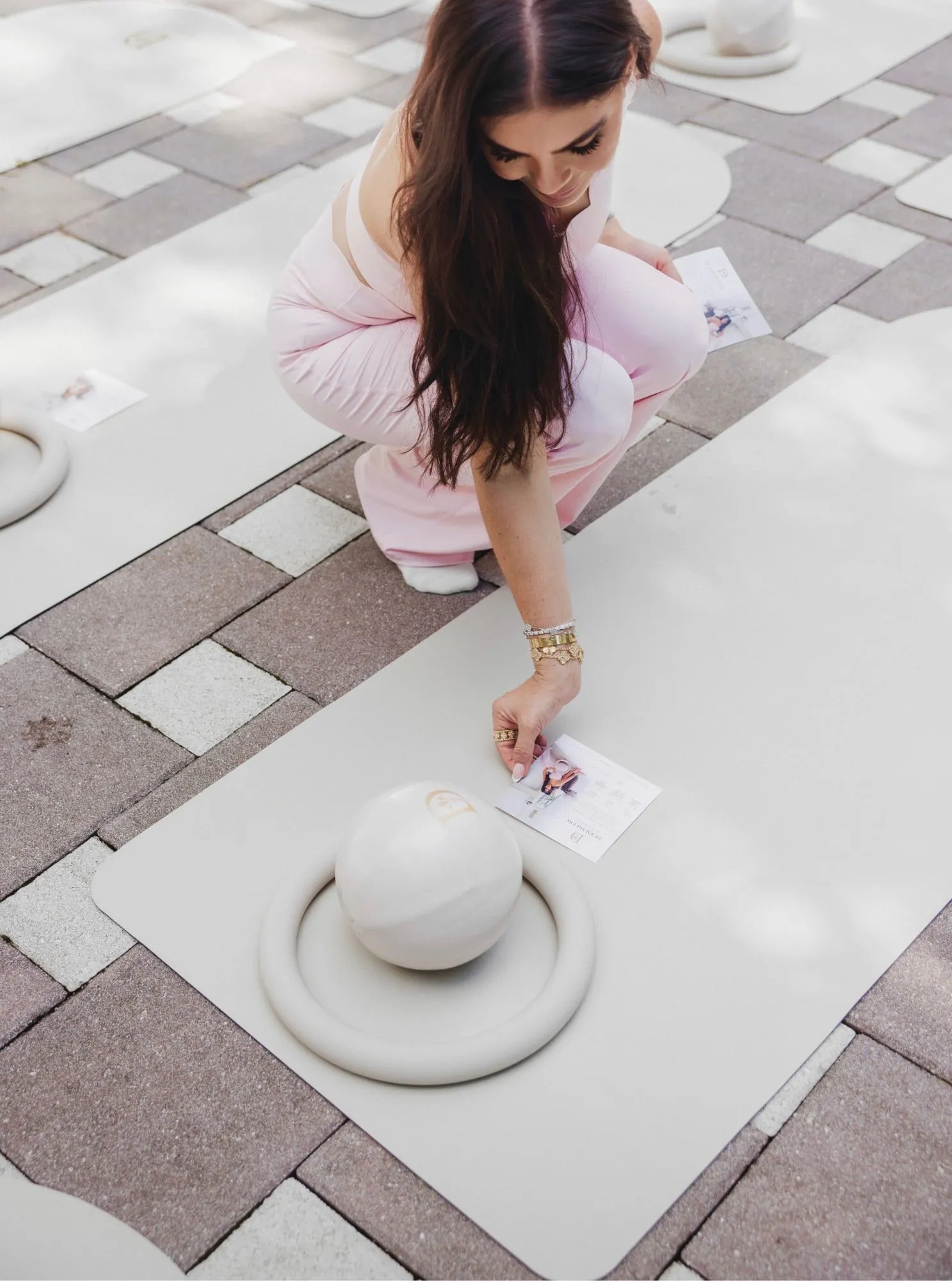 Mats and Pilates balls set up outdoors for a Dermabless Pilates wellness experience.