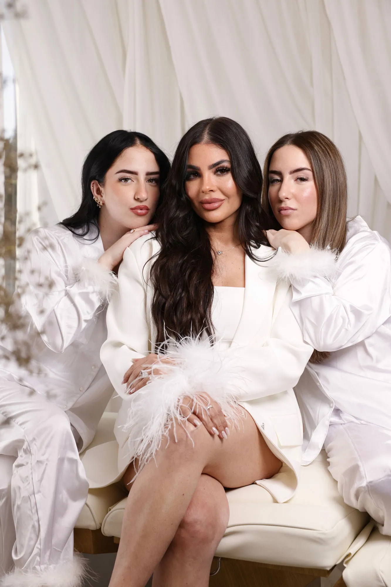 Mily Ajo and the Dermabless artists in a luminous all-white Miami studio.