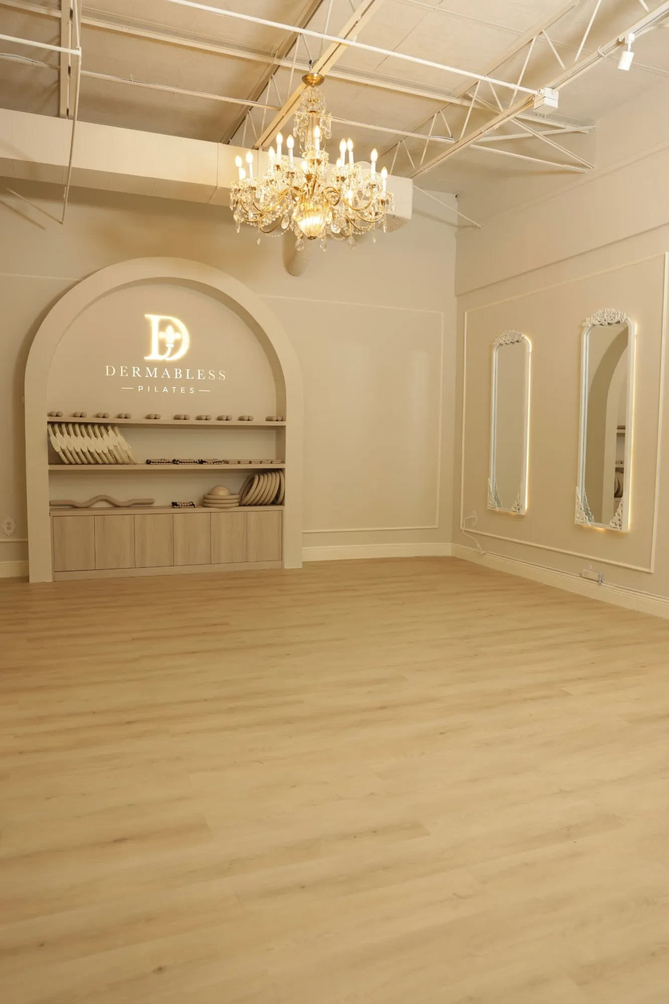 The Dermabless Pilates studio in Miami, with its arch and crystal chandelier.
